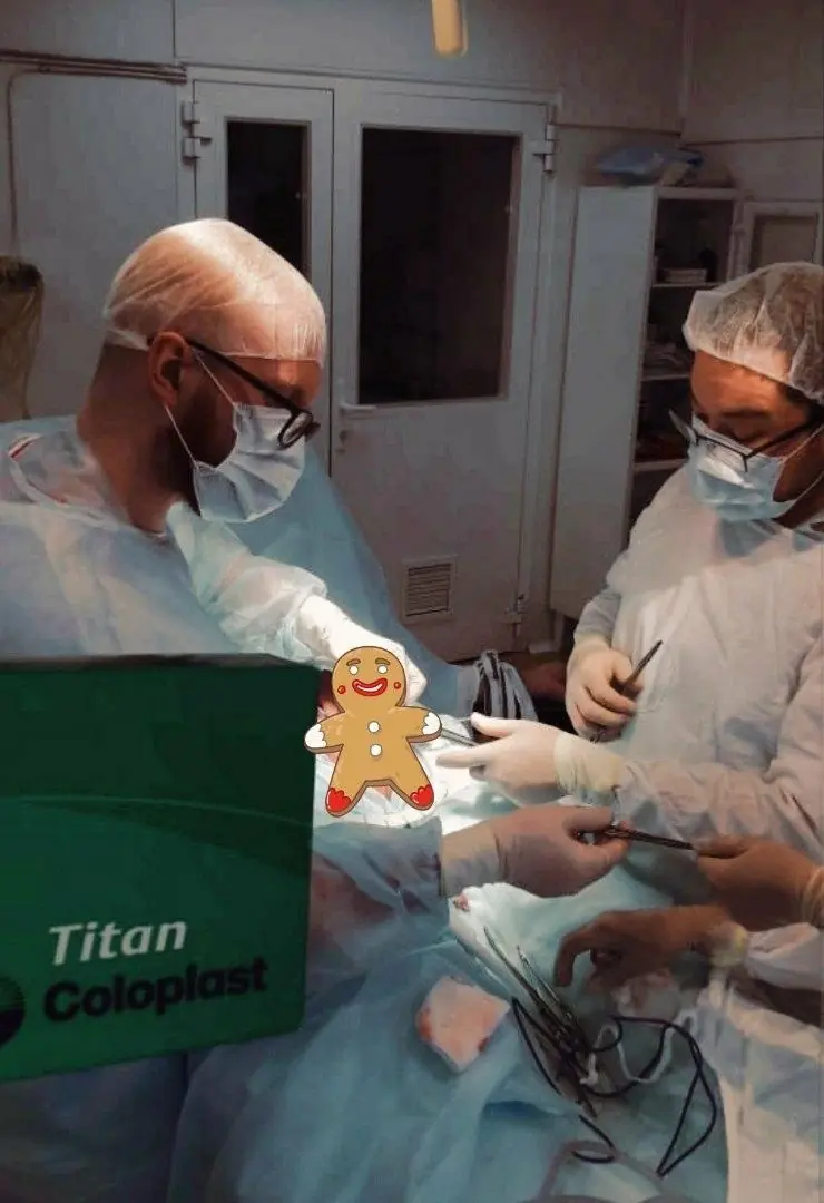 Artem Ershov and the operating team during implantation of a three-piece penile prosthesis